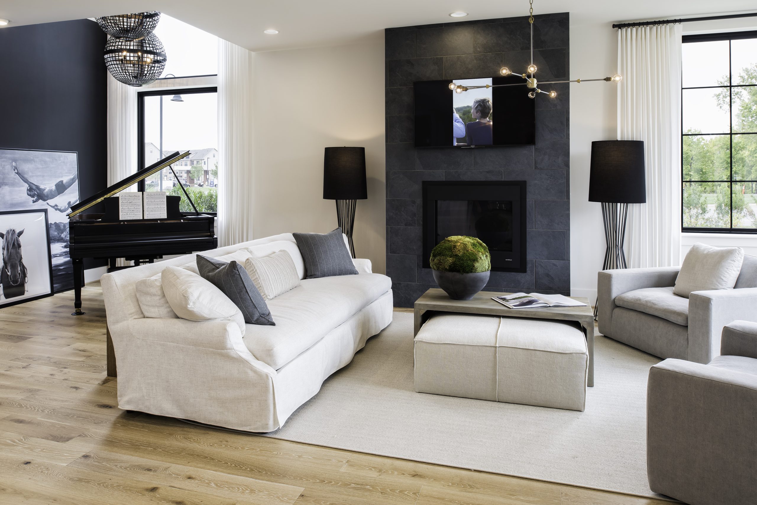 Sofas and armchairs arranged around a dark fireplace