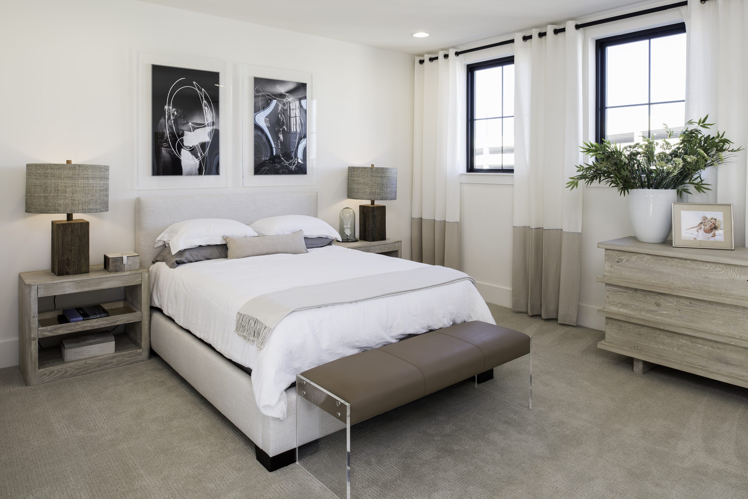 Neutral bedroom with an upholstered bed and matching bedside tables