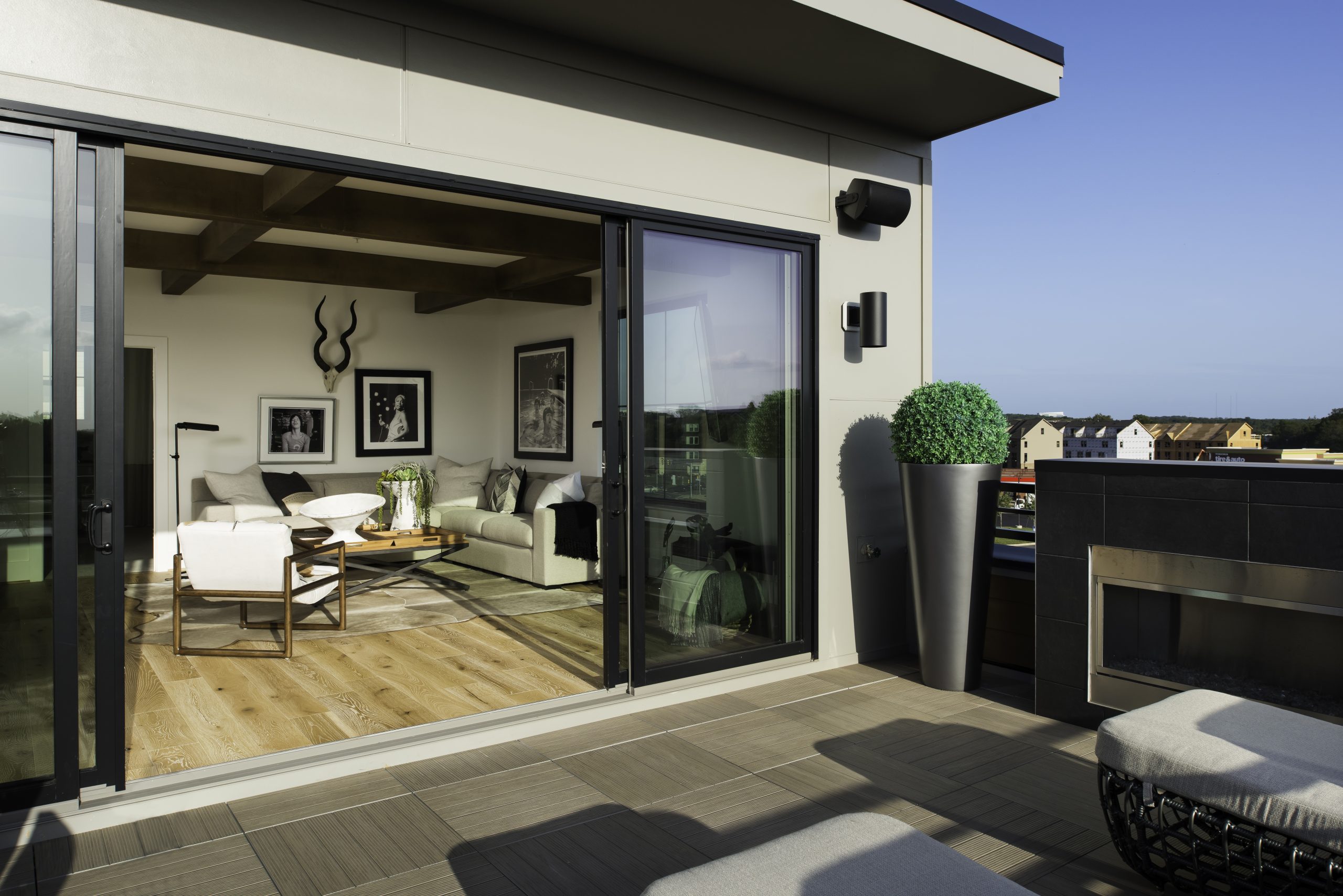 Terrace looking into a lounge through open sliding doors